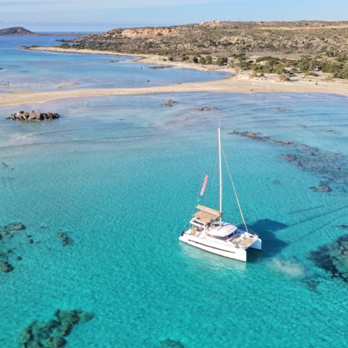 Luxury DanEri catamaran anchored in turquoise water during a Crete cruise